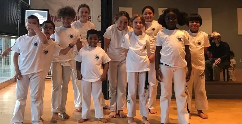 Tucson Capoeira students standing together in training uniforms