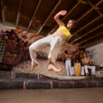 Woman training capoeira at Tucson Capoeira – United Capoeira Association